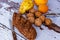 Still life with fresh bread with cereals, walnuts, pear, peach and apricot