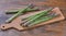 Still life with fresh green Asparagus stalks on wooden chopping board