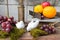 Still life of fruit and bird ceramic plaster round plant at hou