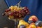 Still life with fruit and a bottle of wine. Apples, pears, plums, grapes and nectarines.