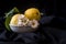 Still life with glass, lemons and bowls