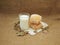 Still-life with a glass of milk, homemade bread and dried clover