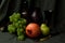 Still life with grapes, pomegranate, vine and gold knife