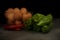 Still life with green peppers and bowl with brown eggs