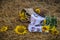 Still life of hats and baskets with sunflowers