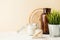 Still life with home decor candle, vase, green plant in a pot with space for text. Horizontal photo, life style concept