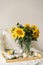 Still life in home interior of living room. Sunflowers, Coffee and open book. Read, Rest