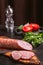 Still life with homemade duck sausage, boiled and smoked