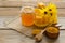 Still life from honey, wax, honeycombs, flowers