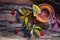 Still life with hot tea from dogrose and lemon autumn leaves