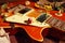 Still life with a jazz vintage electric guitar, dried flowers and rare music notes closeup