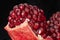 Still life. Juicy ripe opened pomegranate fruit with seeds