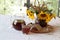 Still-life with kvass (kvas) in a transparent jug and a bouquet