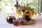 Still-life with kvass (kvas) in a transparent jug and a bouquet