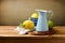 Still life with lemons and blue enamel jug