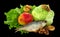 Still life of lettuce, cabbage, dried fruit, apple, drying, dried fish, nuts and dried apricotsIsolated on black background