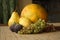 Still life with melon, grapes, figs and pears. Autumn harvest concept.