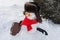 Still life of Merry Christmas and a Happy New Year. A happy snowman in a fur sable hat, red mincemeat and sunglasses with a suitca