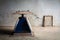 Still life with old blue scales and old photo frame on cement wall