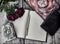 Still life with old decorated book with shabby pages, roses on wooden planks background