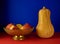 Still life. Old metal vase, apples and pumpkin