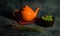 Still life with an orange teapot