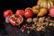 still life with organic autumnal fruits and walnuts