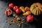 still life with organic autumnal fruits and walnuts