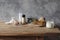 Still life of organic handmade soap bar, wooden brush, moisturizer, shampoo, Himalyan salt and eucalyptus on wooden