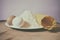 Still life photo, colored eggs, white plate with flour and homemade pasta, on pine wood