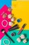 Still life photography, cosmetics to multi-colored bright background, pink, yellow, green, lipstick, lip gloss, eyeshadow, eyeline