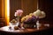 still life with plates full of fruits and flowers in vase on wooden background