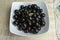 Still life with portion of jaboticaba, Brazilian grape, in white platter