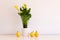 Still life with potted golden arum and yellow pears