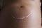 Still life of pregnant woman with smile stretch mark cream