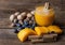 Still life of pumpkin juice with cranberries and autumn nuts