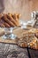 Still life recipe homemade honey ginger oatmeal cookie, pirouette rolled wafer and grain stick on wooden table kitchen