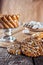 Still life recipe homemade honey ginger oatmeal cookie, pirouette rolled wafer and grain stick on wooden table kitchen