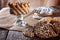 Still life recipe homemade honey ginger oatmeal cookie, pirouette rolled wafer and grain stick on wooden table kitchen