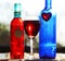 Still life red blue wine glass bottles & heart & pottery charms