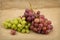 Still life with red and green ripe grapes