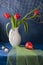 Still life with red tulips and red pear