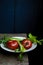 Still life with ripe tomatoes, celery, scallions on old wooden table