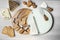 Still life with a round table to cut cheeses and various cutting tools