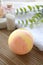 Still life spa resort treatment with bath bomb and towel on wooden background.