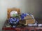 Still life with spring flowers snowdrops, old books clock on the table.