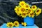 Still life with sunflowers. bouquet of sunflowers in a bucket. vintage rural still life with flowers. grunge still life