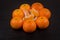 Still life of tangerines. Mandarins are made in the form of a vase for slices