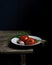 Still life with tomatoes and scallions on old wooden table