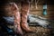 Still life with traditional leather boots on barn background